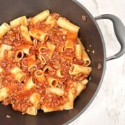 Rigatoni and Meat Sauce in a pot with garlic tomato sauce and Italian spices