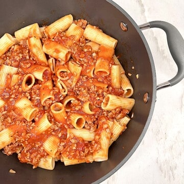 Rigatoni and Meat Sauce in a pot with garlic tomato sauce and Italian spices