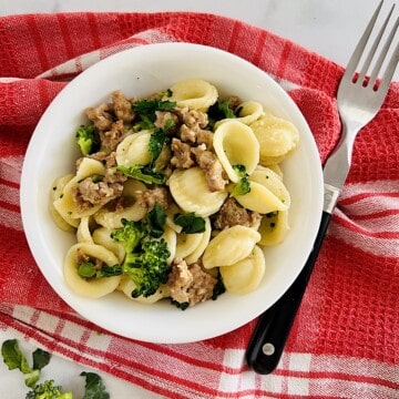 Italian recipe for classic Orecchiette with Sausage and Broccoli Rabe in a bowl.