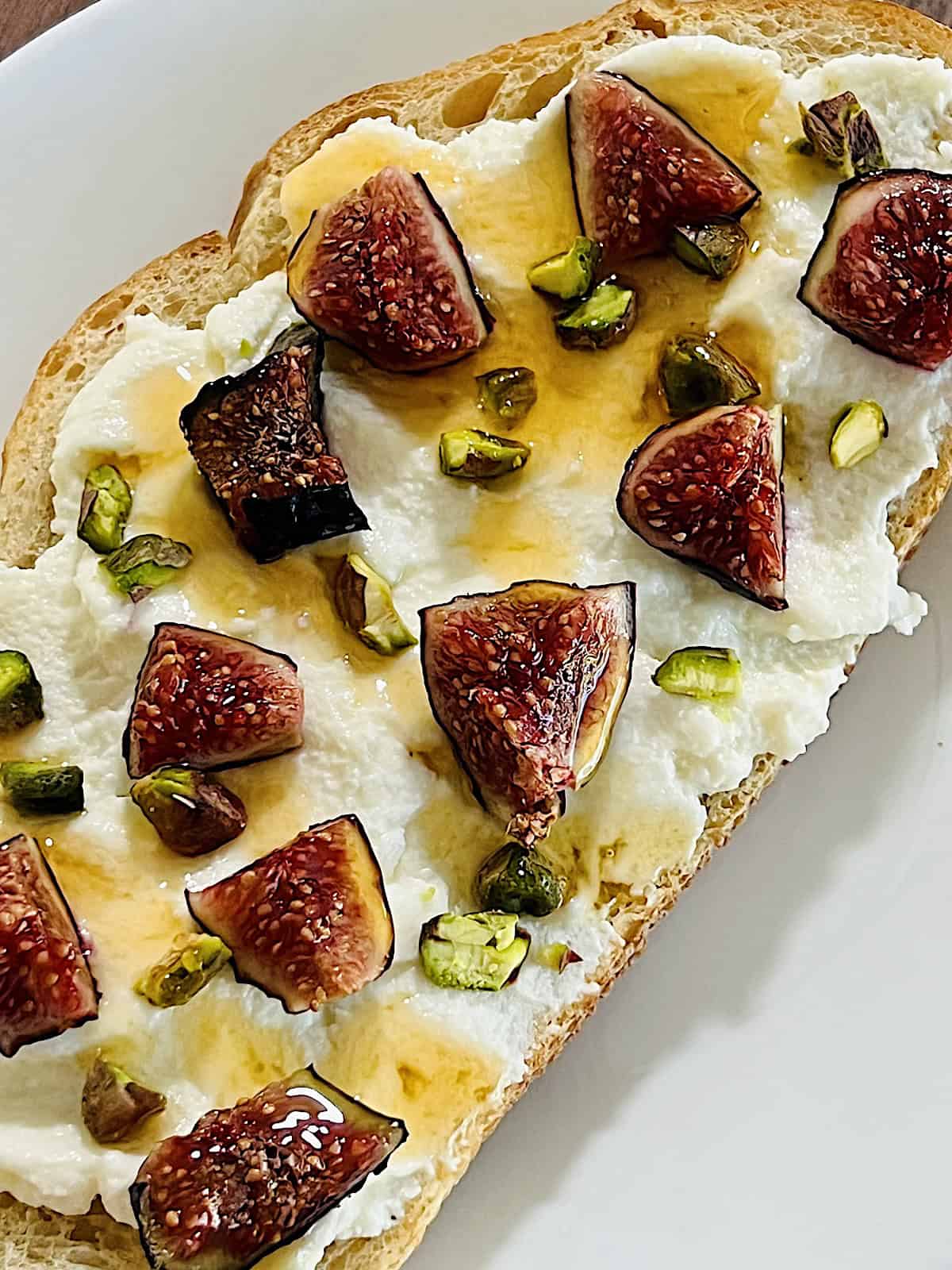 Ricotta Fig Toast Best recipe with pistachios and hot honey drizzle on top.