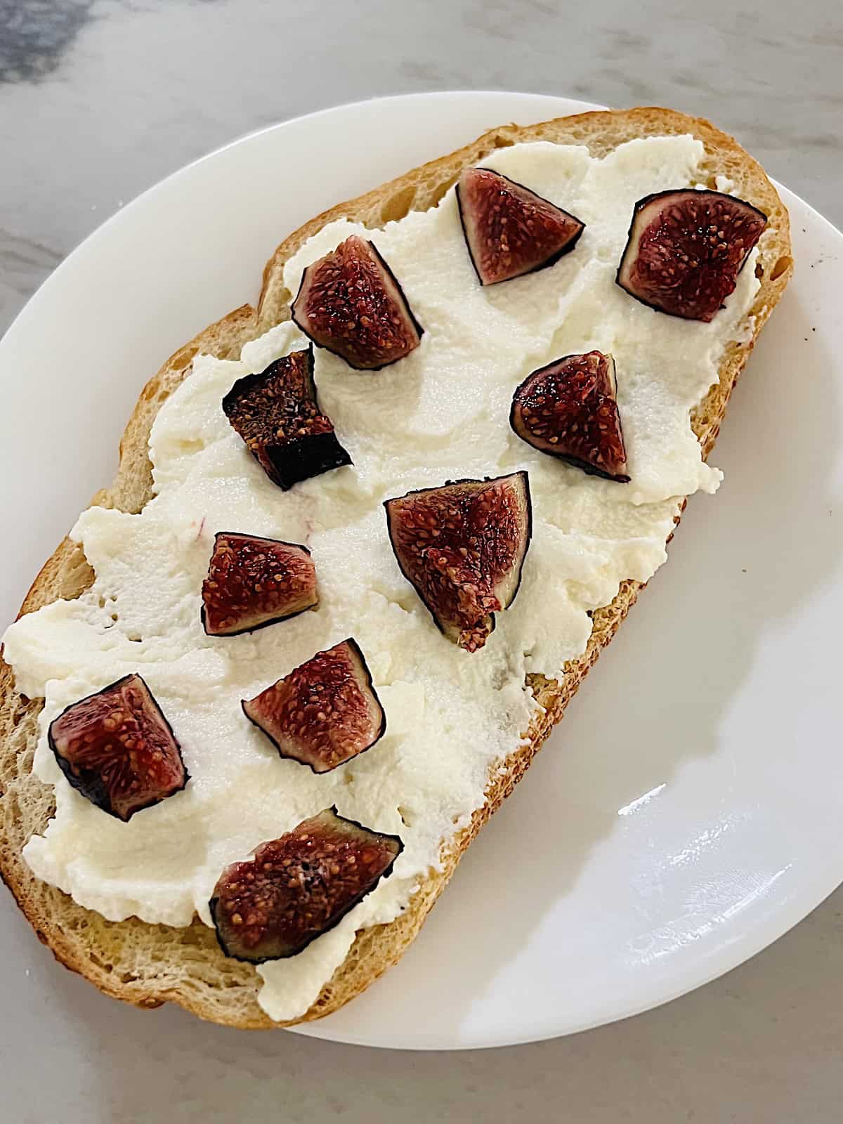 Bread topped with ricotta and diced figs.