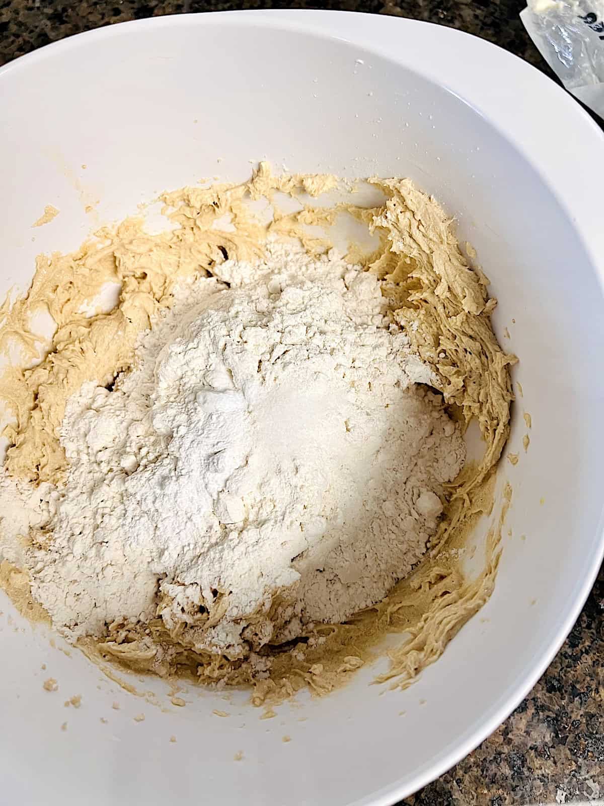 Dry ingredients added to wet in a bowl.