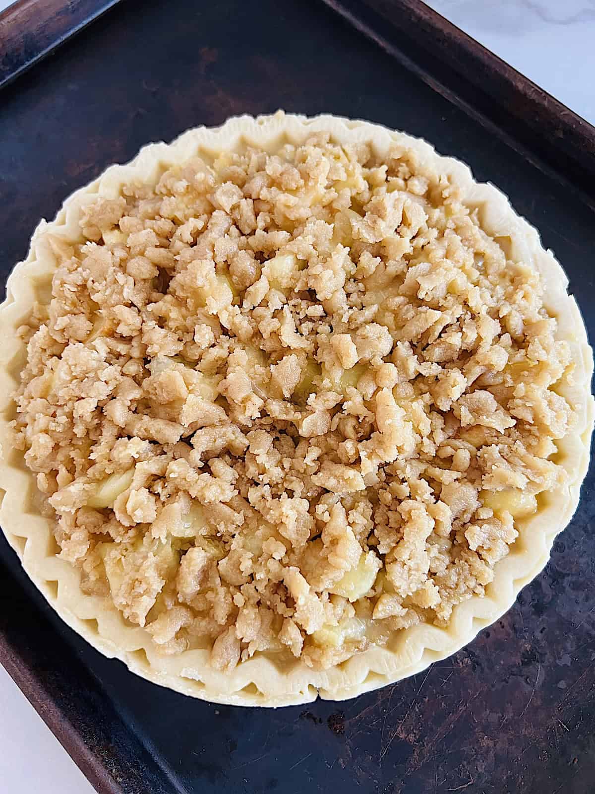 Peach Crumble Pie Assembled and ready to bake.