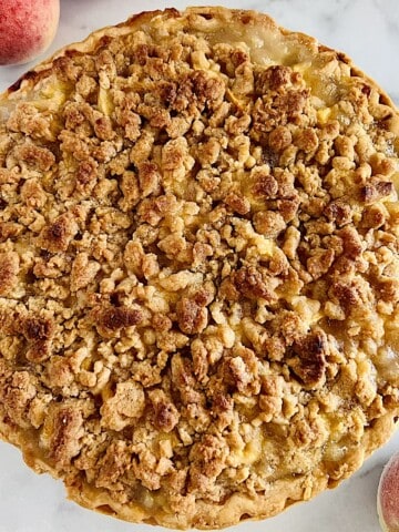 Peach Crumble Pie fresh baked unsliced.