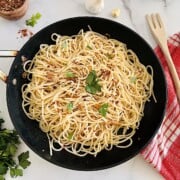 Spaghetti Aglio Olio e Peperoncino pasta with olive oil garlic and chili in a pan ready to eat.