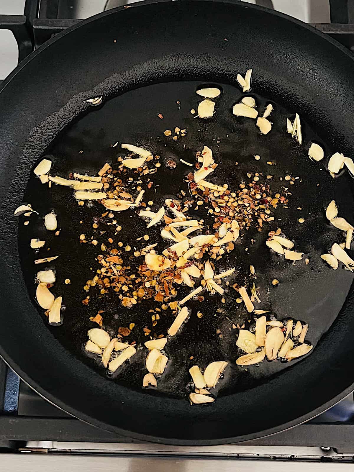 Pan with garlic olive oil and chili pepper flakes.