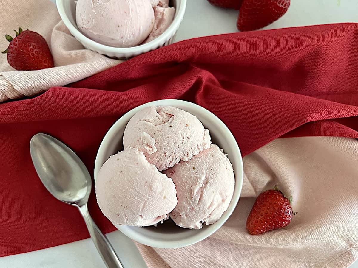 Strawberry Ice Cream in two bowls a lovely pink color from fresh real fruit.