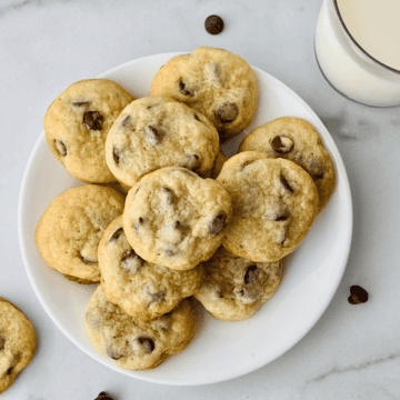 Plate of homemade chewy chocolate chip cookies made without brown sugar.