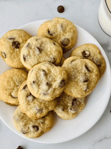 Plate of homemade chewy chocolate chip cookies made without brown sugar.