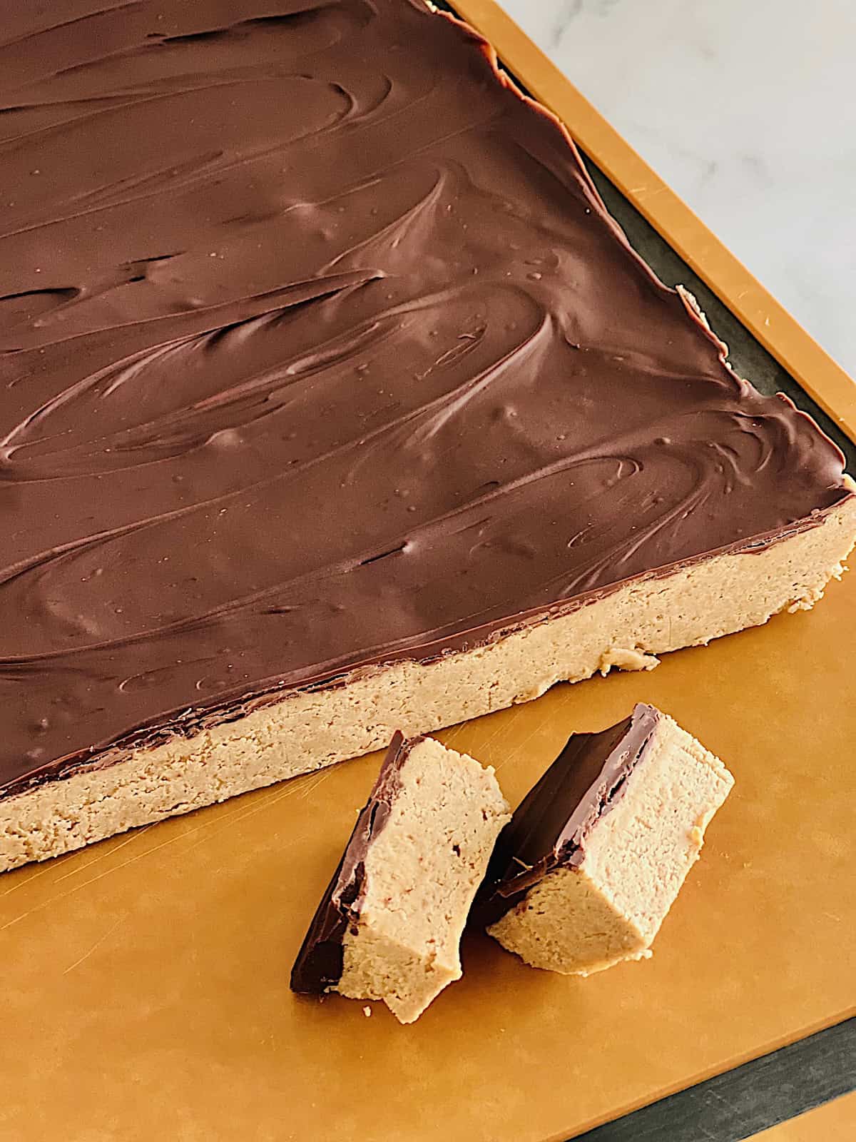 No Bake Chocolate Peanut Butter Bars Cutting bars into servings.