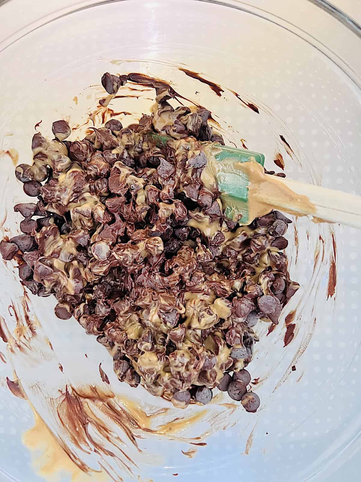 No Bake Chocolate Peanut Butter Bars Glass bowl with pb and chocolate chips to melt in microwave.