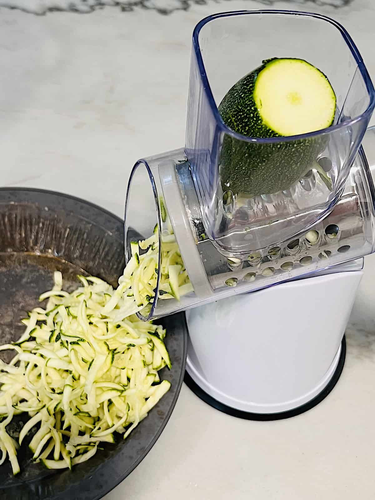 Grating squash in rotary tool.