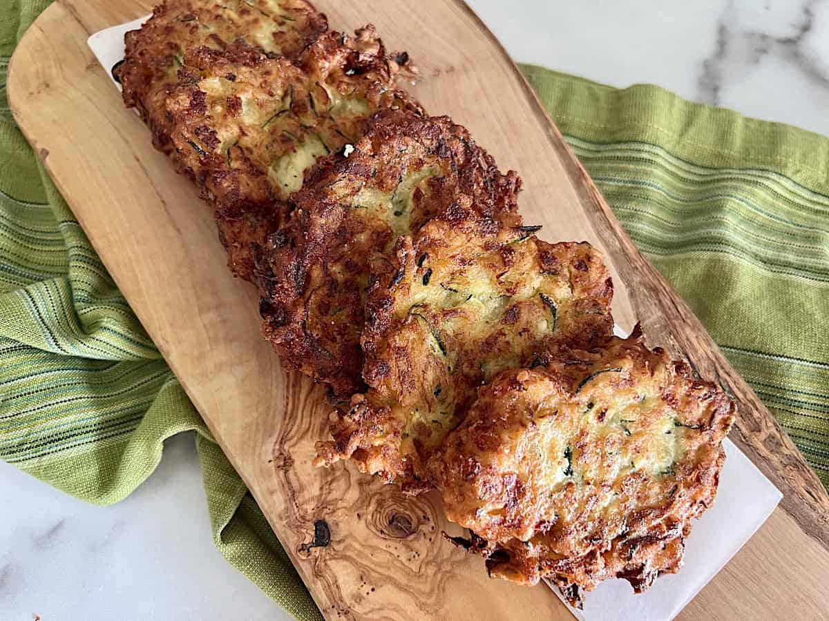 Zucchini Fritters (frittelle di zucchine) Italian recipe for fried summer squash pancakes with cheese.
