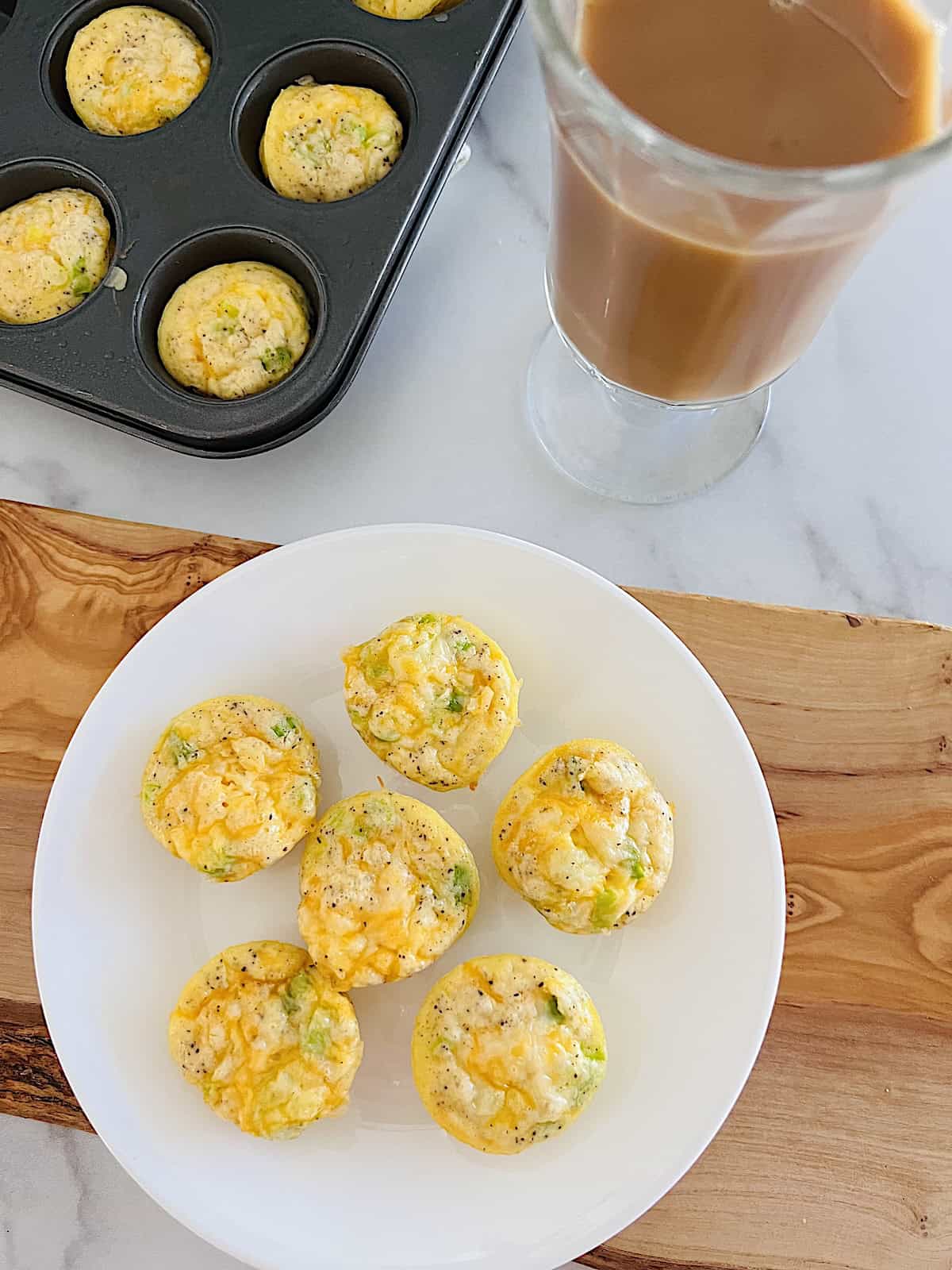 Mini Egg Bites Best recipe made in mini muffin tin with cheese, ham and green onions.