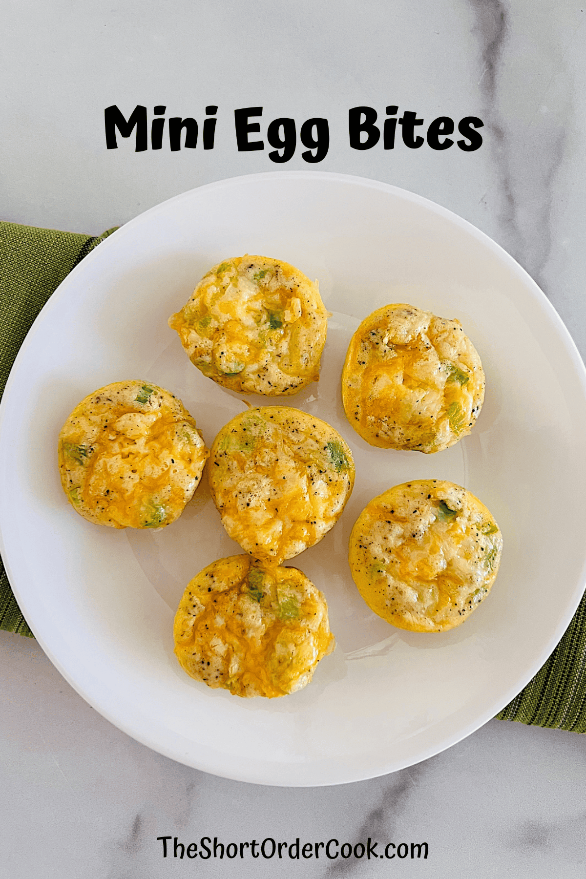 Plate with ham & cheese egg muffin bites.