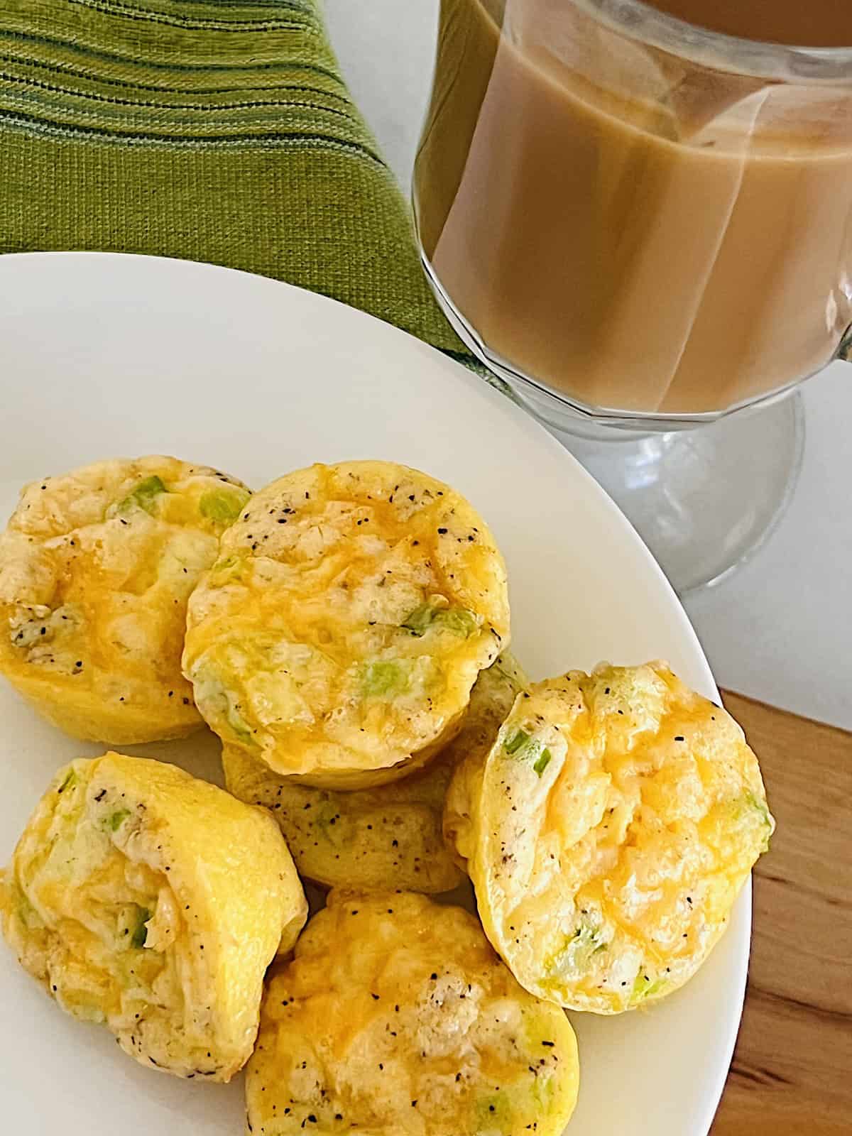 Mini Egg Bites Plated closeup with mug of coffee.