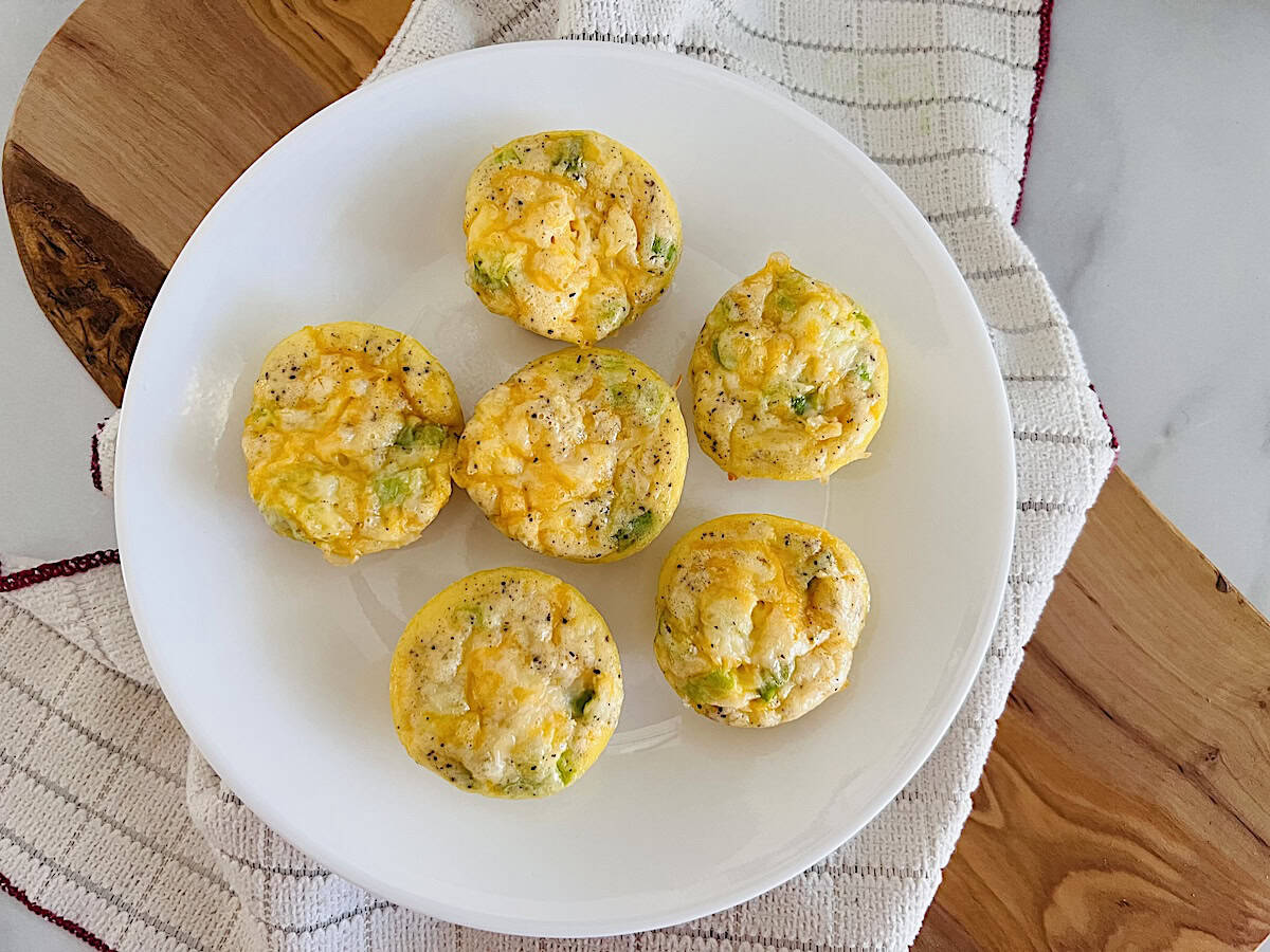 Mini Egg Bites oven baked recipe made in mini muffin tin with ham and cheese.