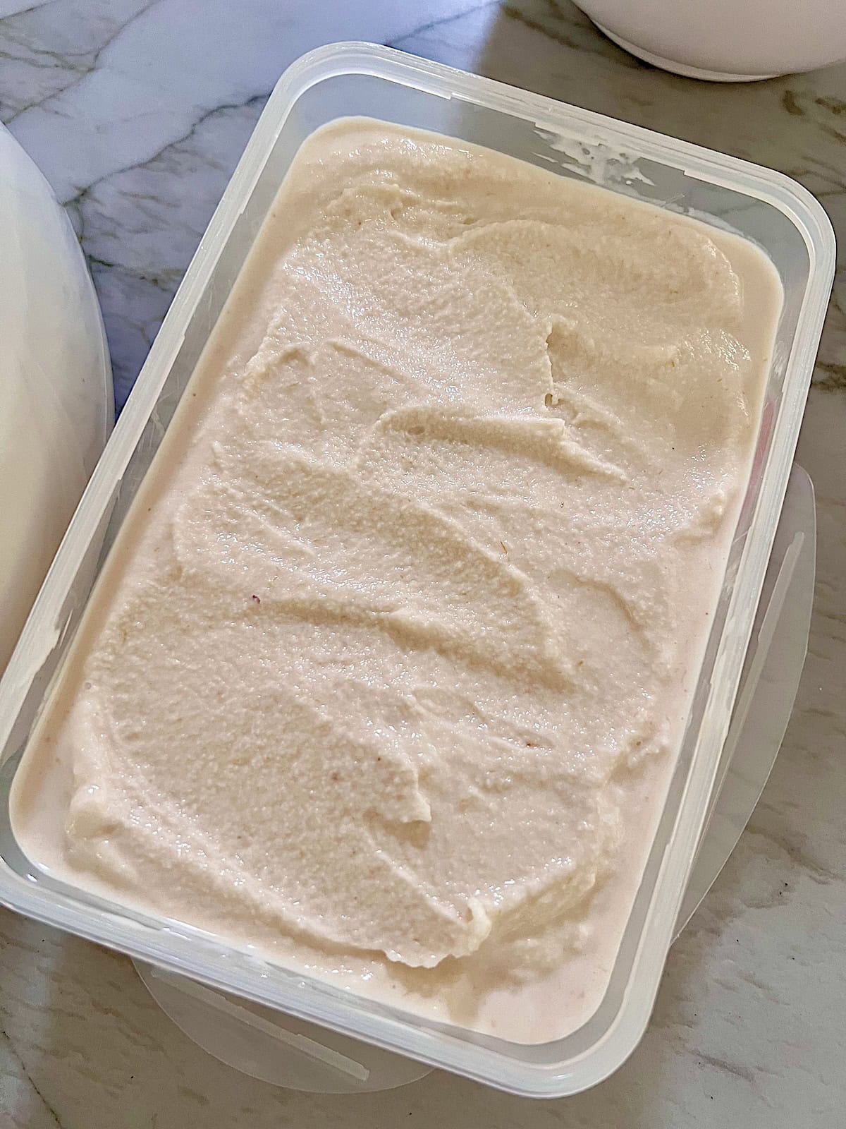 Peach Ice Cream In container to freeze.
