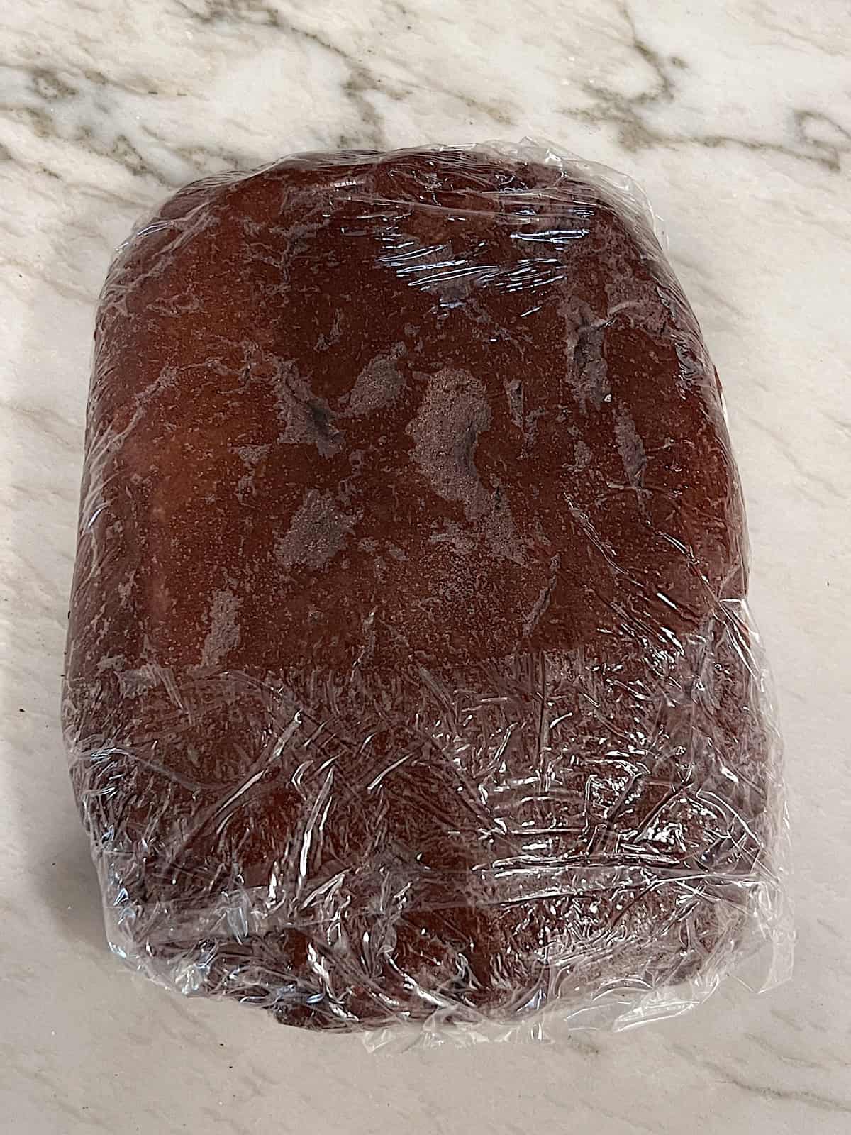Turtle Thumbprint Cookies Dough wrapped to chill.
