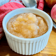 White bowl of homemade apple sauce made with fresh fall fruit in a Slow Cooker .