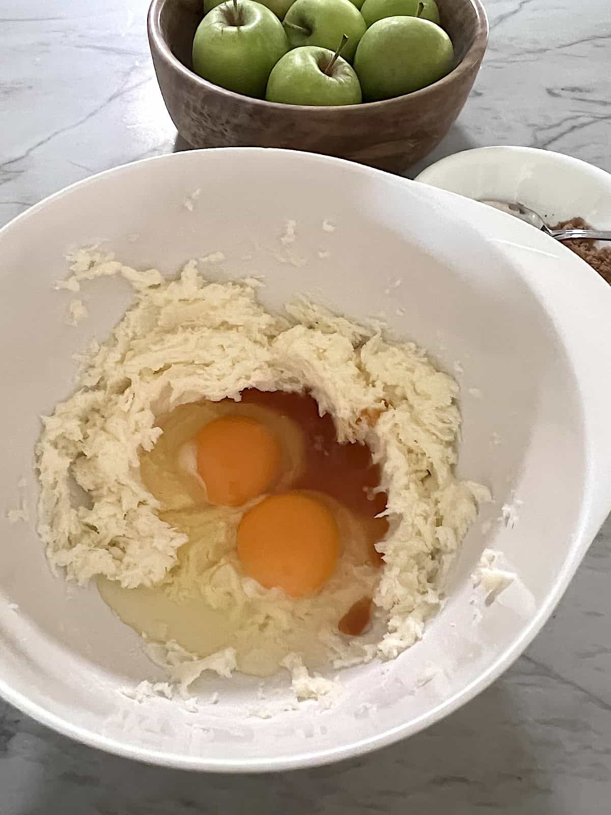 Add eggs and vanilla to creamed sugar butter in bowl.