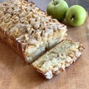 Apple Fritter Bread with Maple Glaze made with fresh apples cinnamon and spices in a loaf pan.