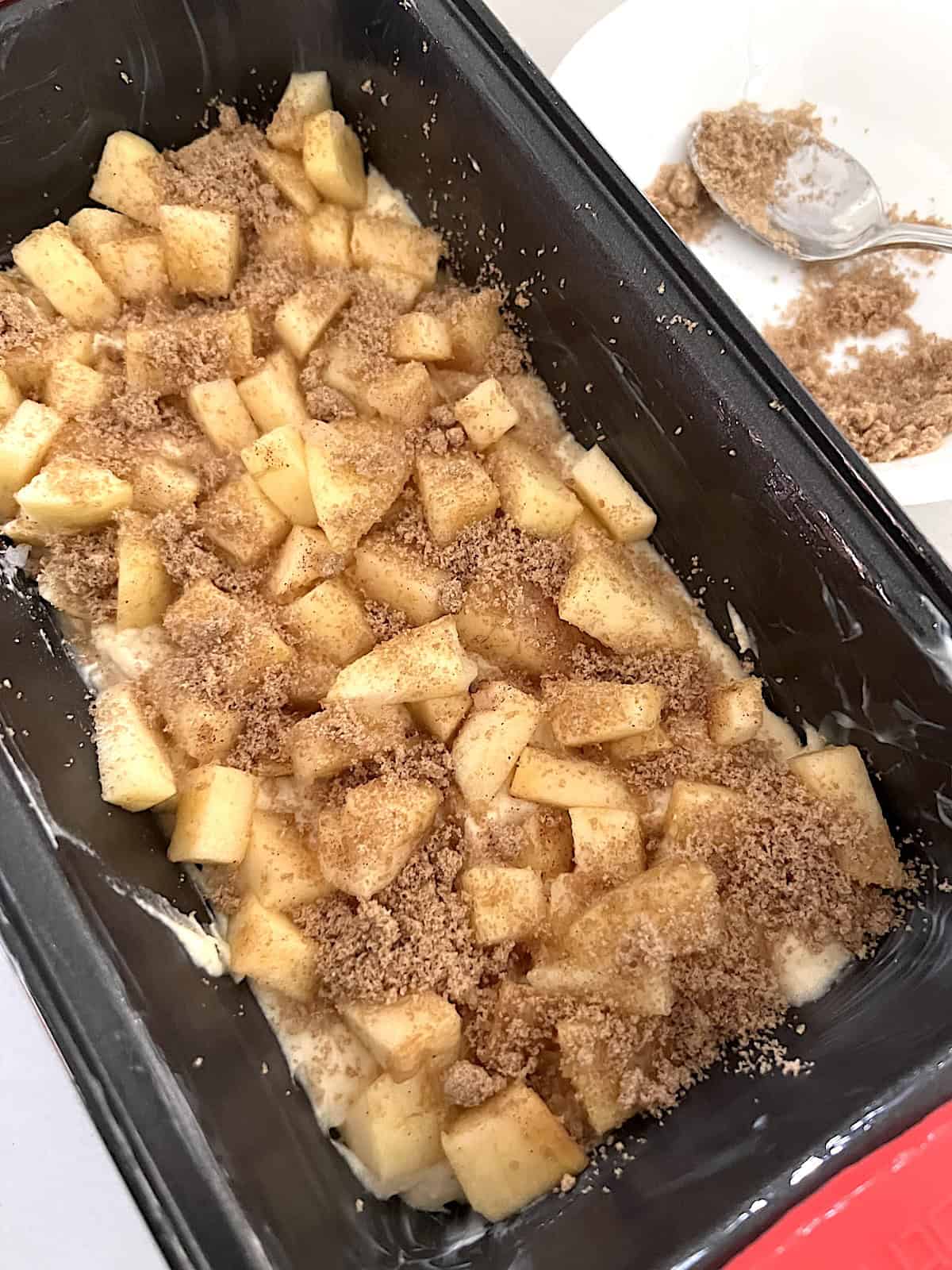 Apple Fritter Bread with Maple Glaze half the batter apples and cinnamon sugar layered