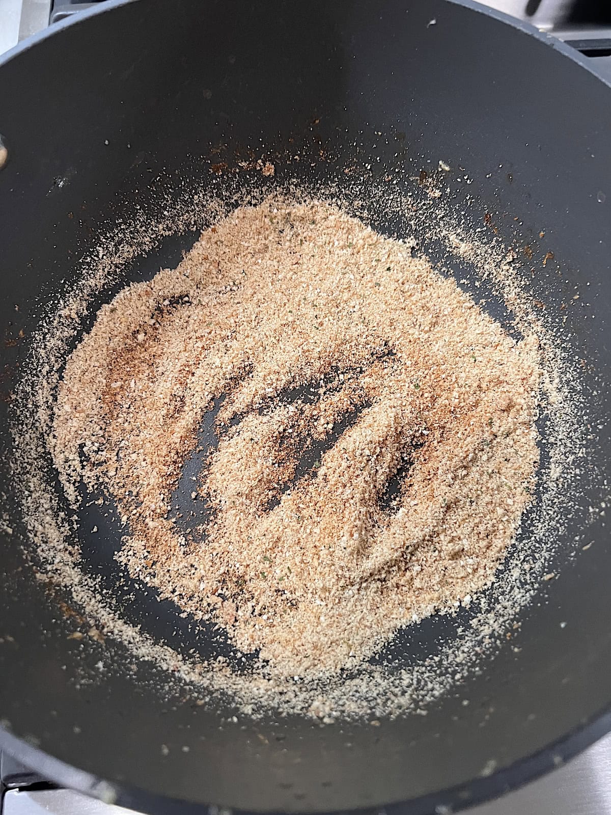 Pot with bread crumbs toasting.