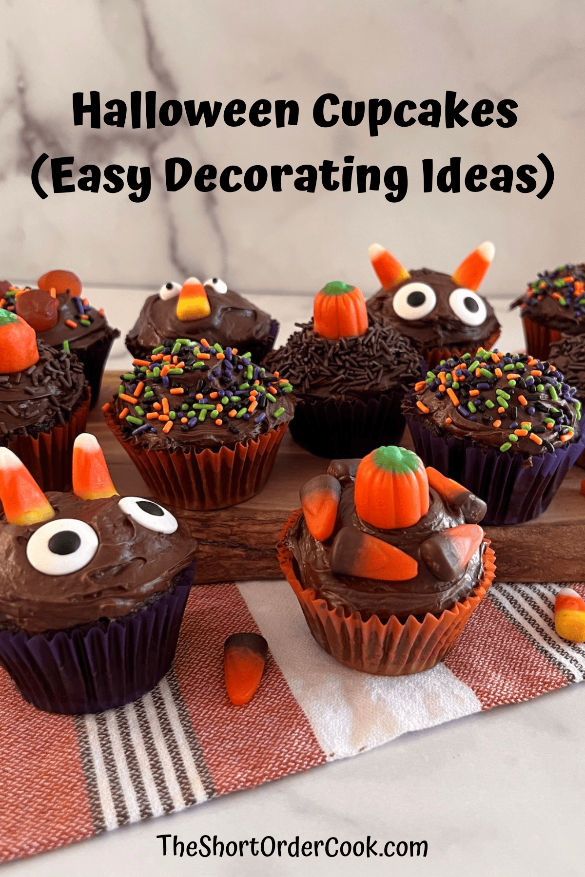 Halloween Cupcakes Baked and designed for the creepy fun cute holiday with sprinkles and candy.