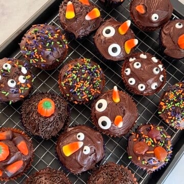 Halloween Cupcakes Baked from chocolate box mix & canned frosting decorated.