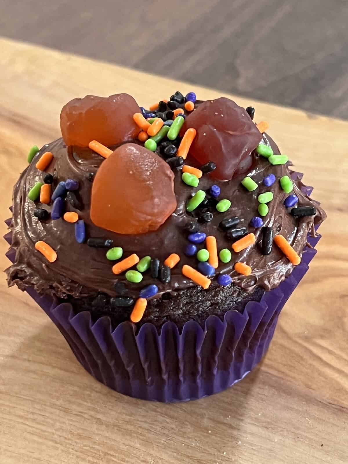 Halloween Cupcakes With colored sprinkles and gummy candies.